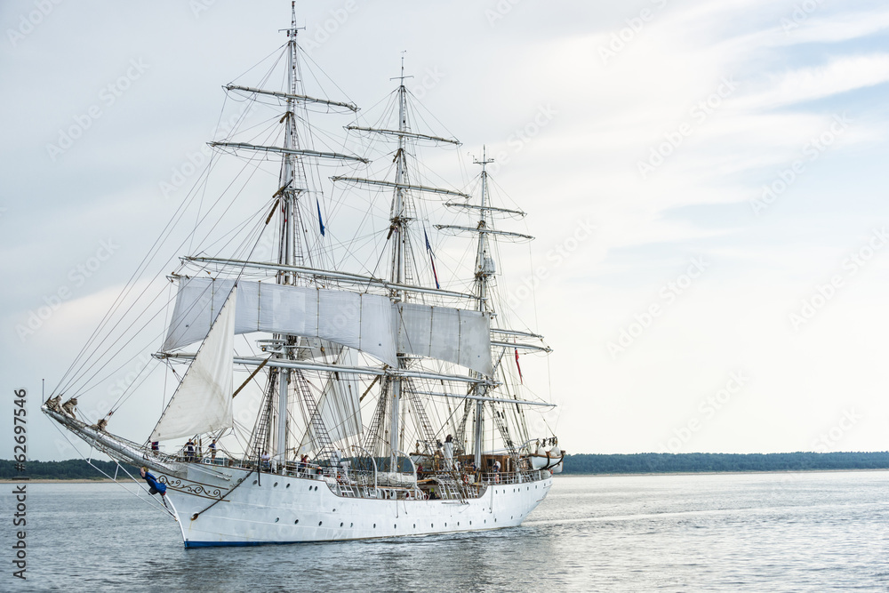 Tall ship on blue water horizontal