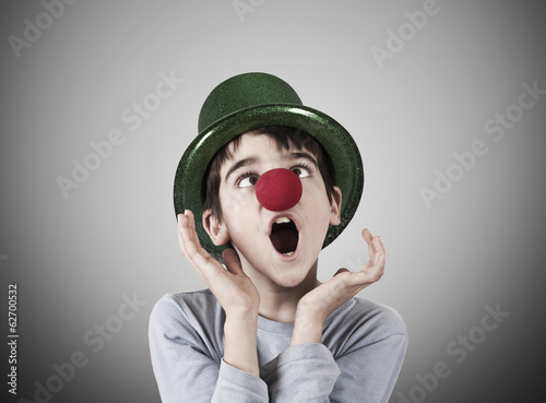 boy with clown nose and hat on background