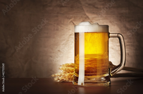 Fotografie Mug of lager beer with spikelets