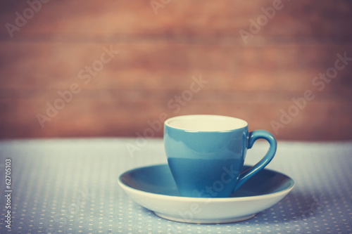 Cup of a coffe on polka dot cover