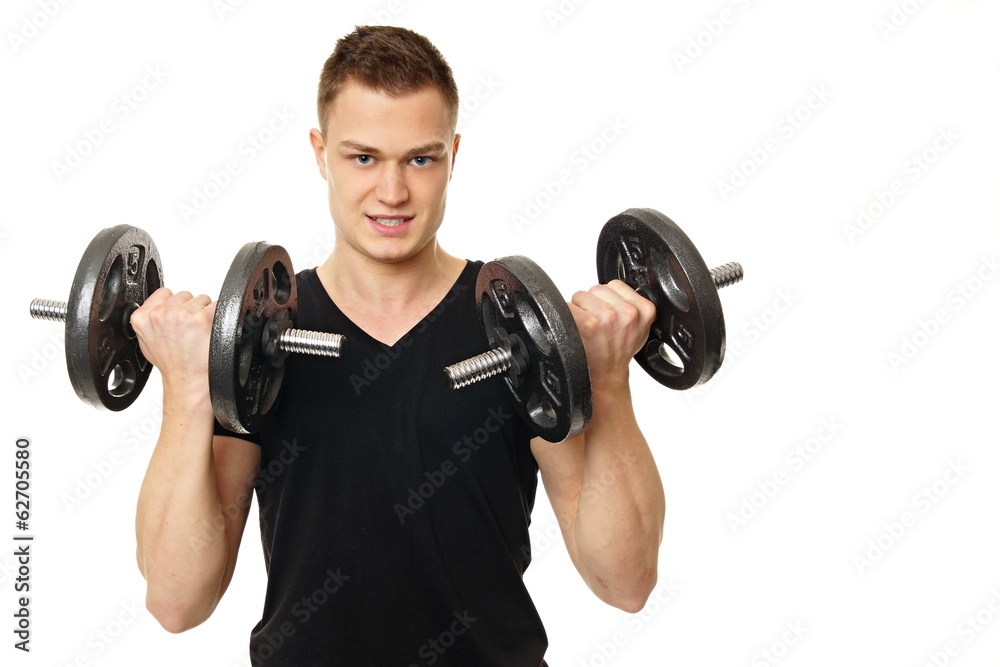 Young man at black shirt exercises with dumbbells Young man at black shirt exercises with dumbbells