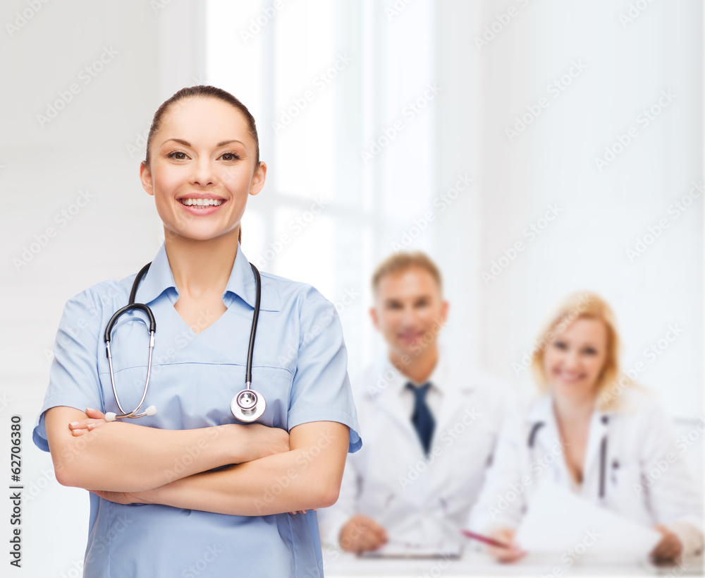smiling female doctor or nurse with stethoscope smiling female doctor or nurse with stethoscope