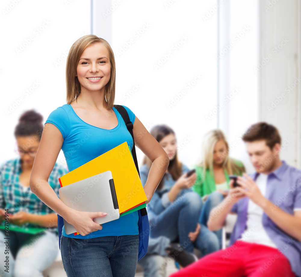smiling student with bag, folders and tablet pc smiling student with bag, folders and tablet pc