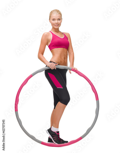 young sporty woman with hula hoop