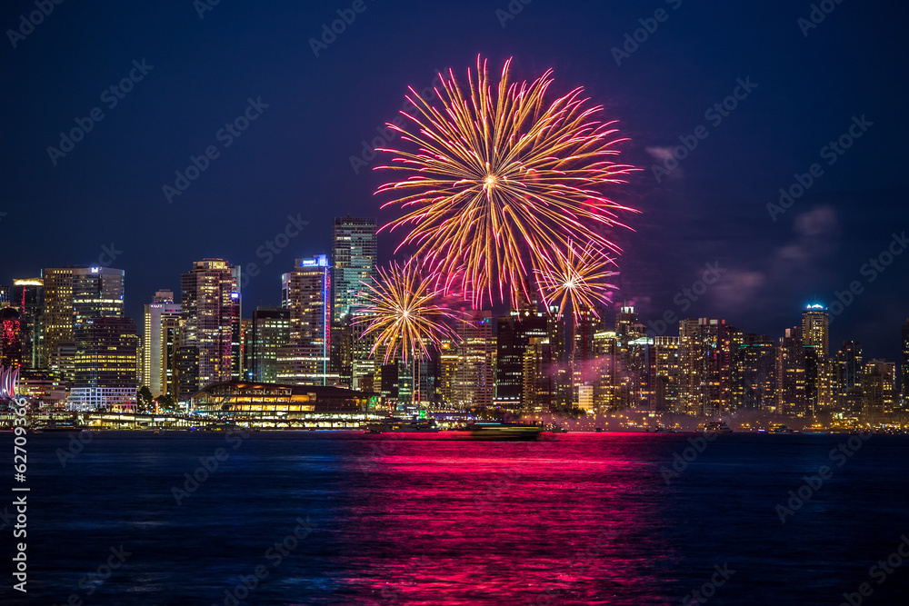 Celebration of Canada Day on July 1st with a colorful fireworks display in Vancouver, British Columbia, Canada. Celebration of Canada Day on July 1st with a colorful fireworks display in Vancouver, British Columbia, Canada.