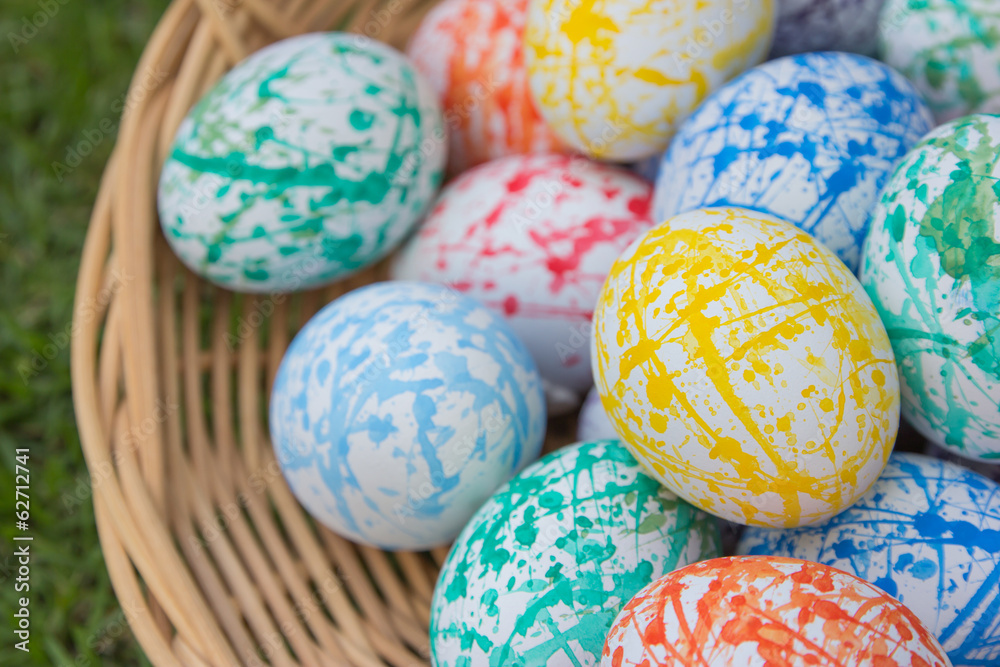 Fototapeta premium Colorful Easter eggs in a basket