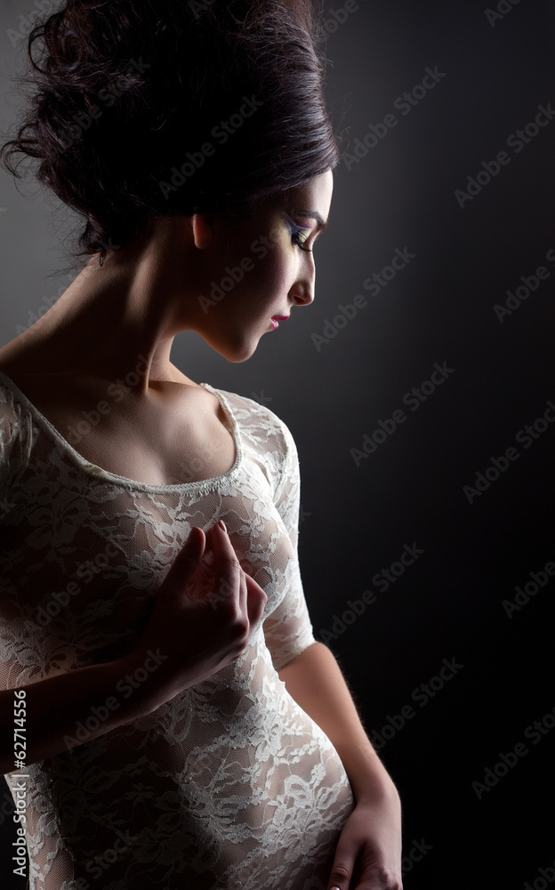 Fototapeta premium Profile of young sexy model in lacy negligee