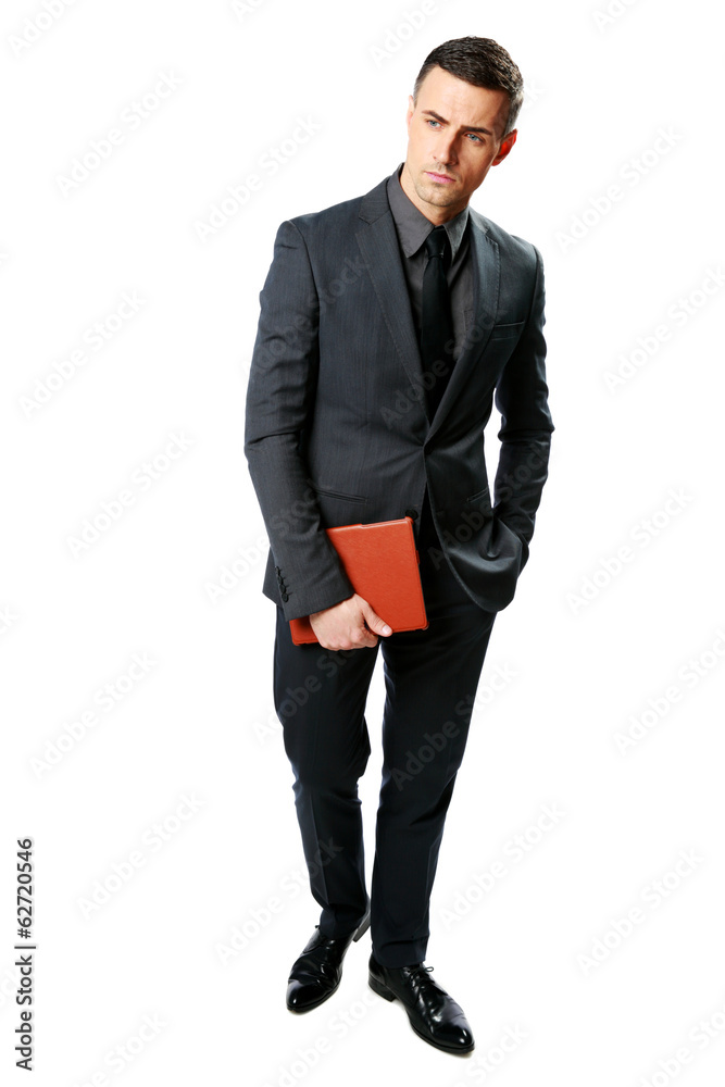 Businessman standing and holding tablet computer Businessman standing and holding tablet computer