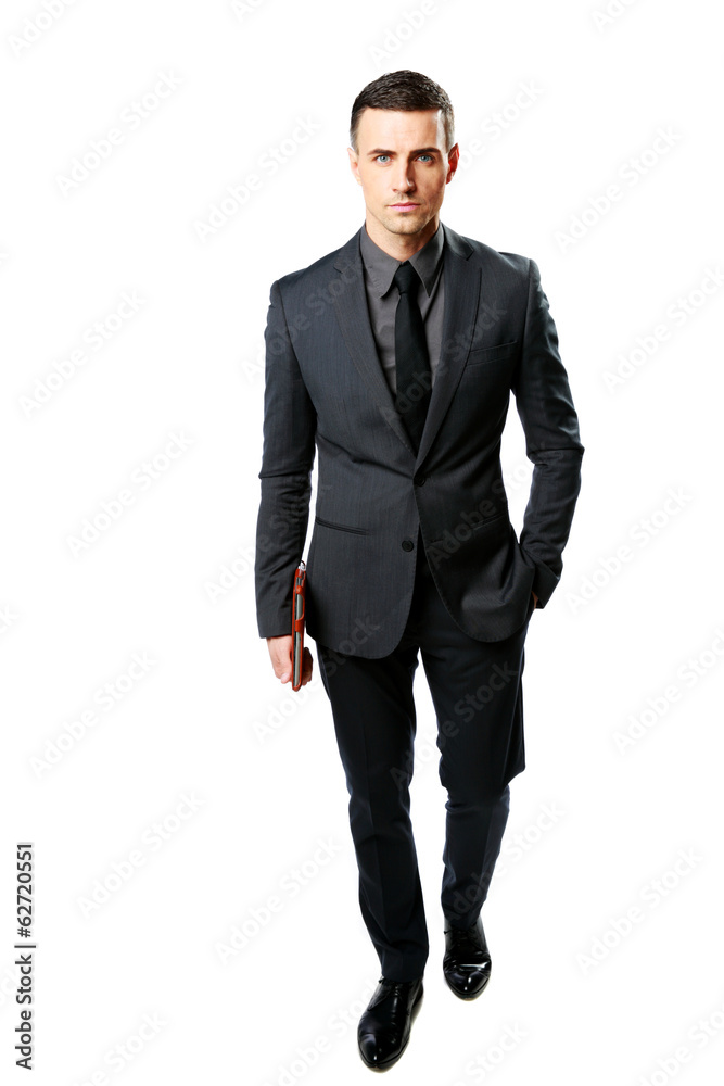 Businessman standing and holding tablet computer Businessman standing and holding tablet computer