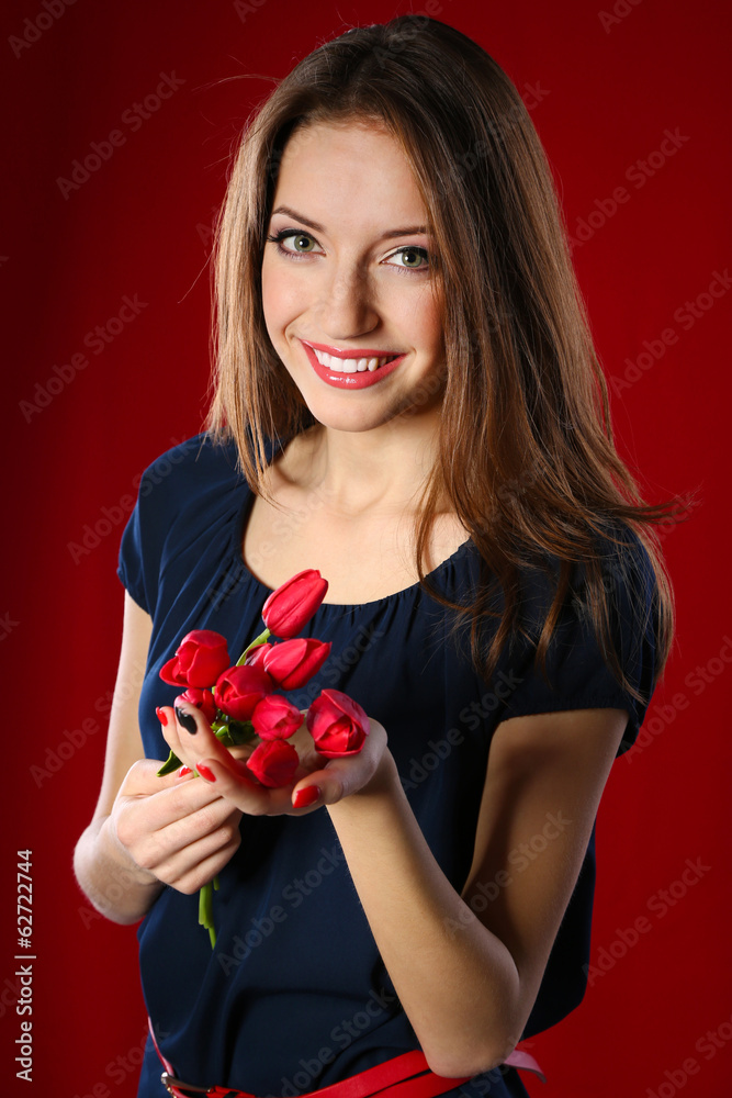 Attractive woman with flowers on color background Attractive woman with flowers on color background