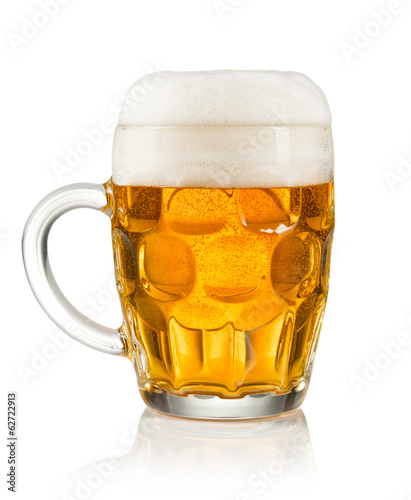 Half litre glass of beer on white background