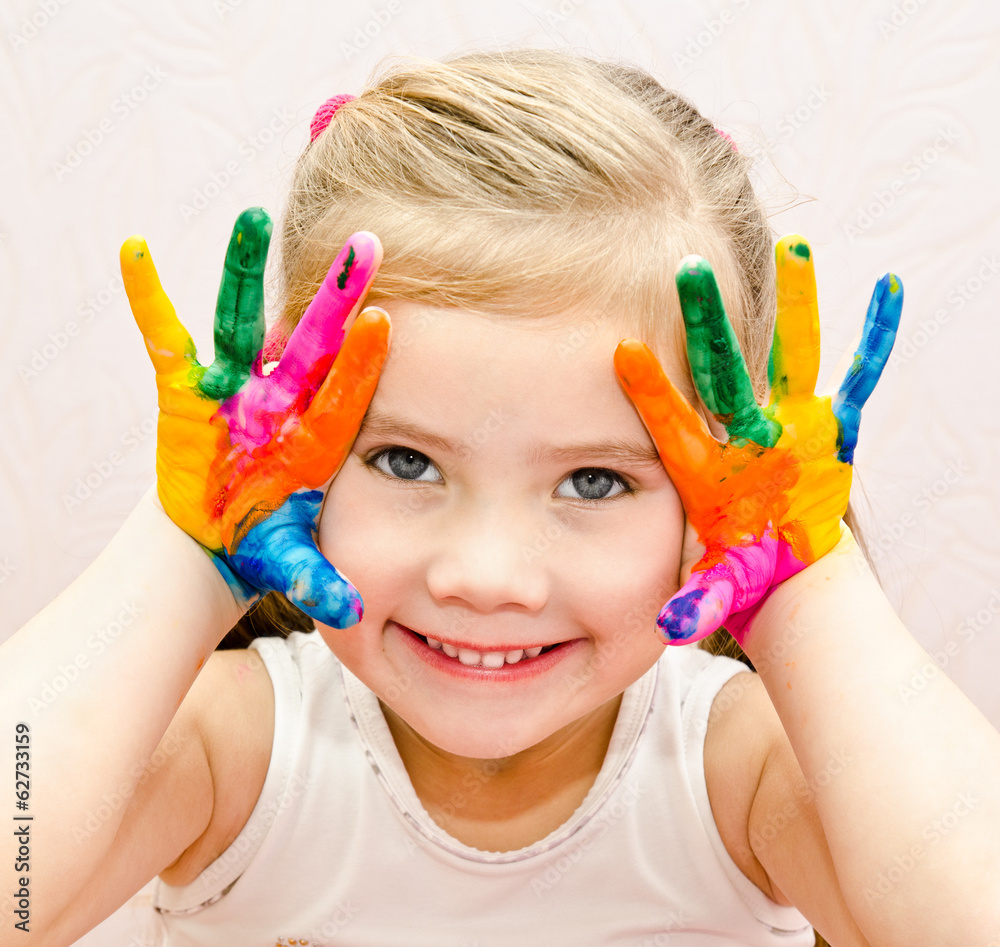 Cute smiling little girl with hands in paint Cute smiling little girl with hands in paint