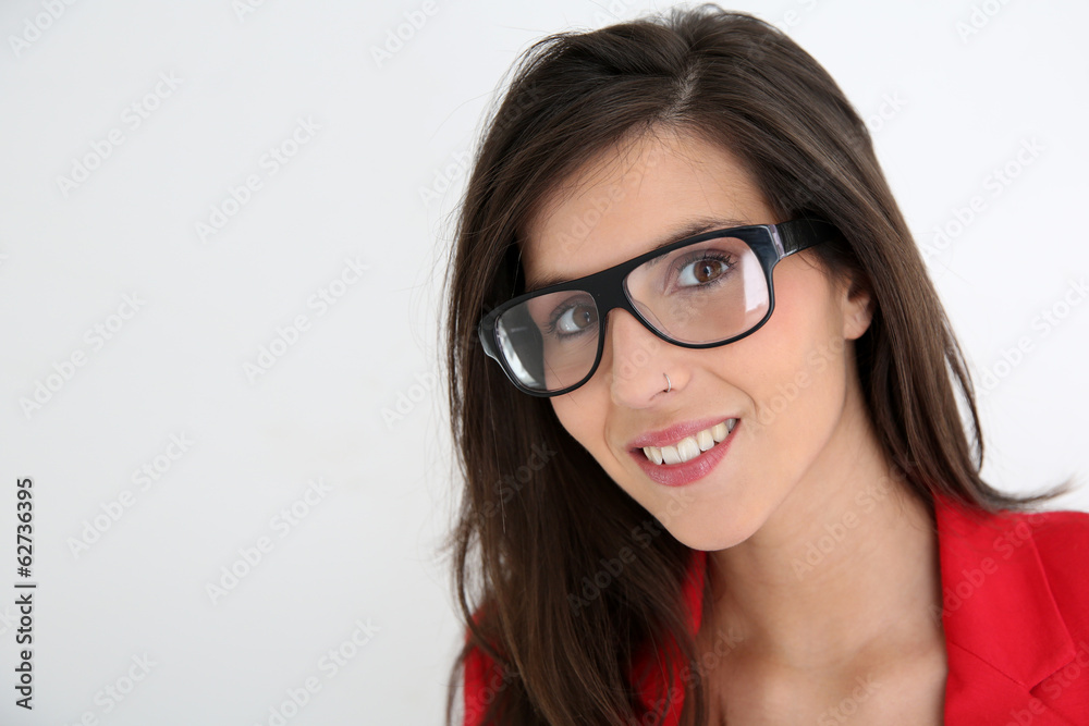 Attractive brunette woman with red jacket and eyeglasses Attractive brunette woman with red jacket and eyeglasses