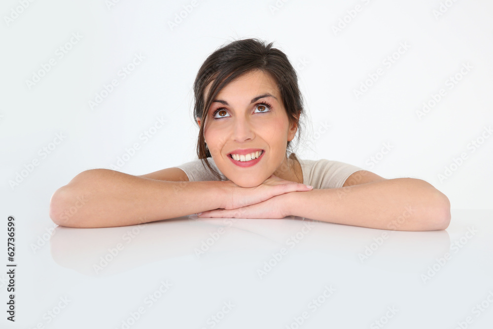 Brunette girl looking up at message, isolated Brunette girl looking up at message, isolated