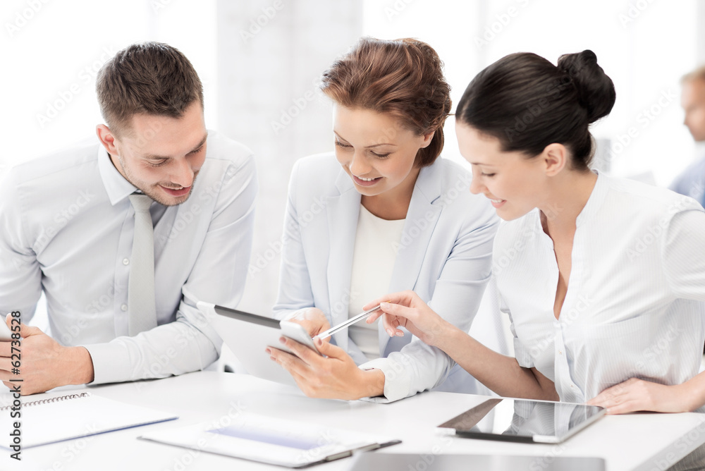 business team working with tablet pcs in office business team working with tablet pcs in office