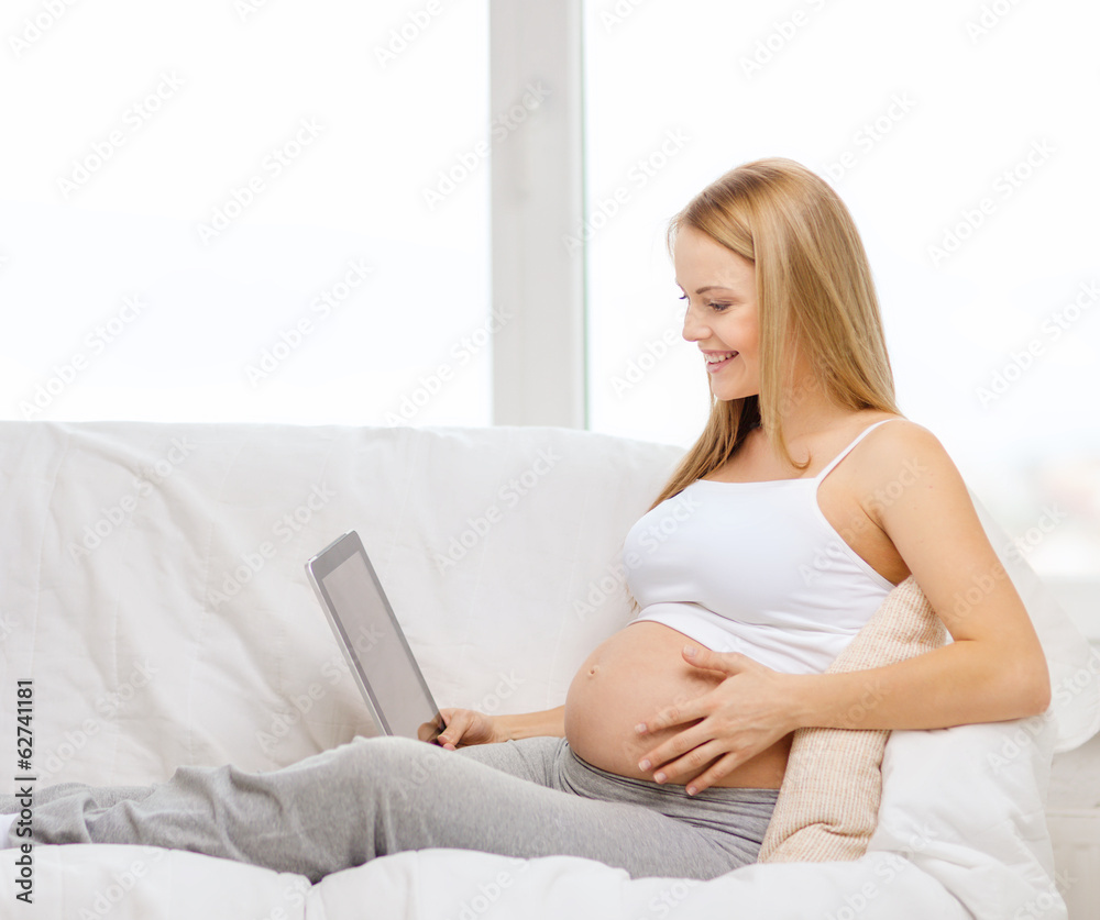 smiling pregnant woman with tablet pc computer smiling pregnant woman with tablet pc computer