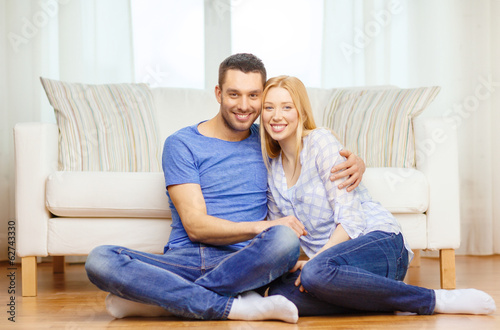 smiling happy couple at home