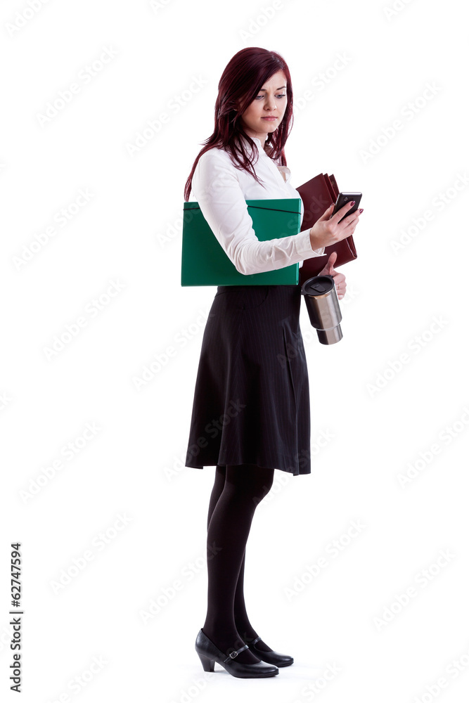 Businesswoman checking mails on her smartphone Businesswoman checking mails on her smartphone