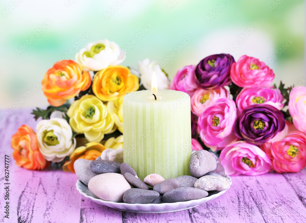 Composition with spa stones, candle and flowers Composition with spa stones, candle and flowers