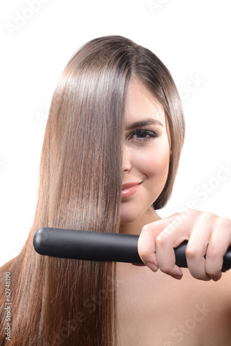 Woman doing hairstyle with ...