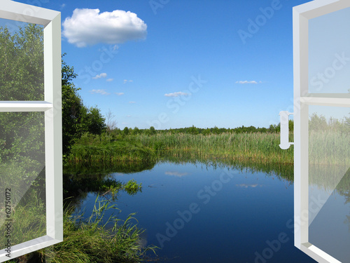 opened window to the lake and meadow
