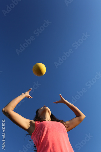 Woman playing with a ball