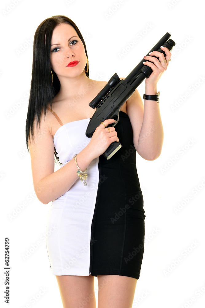 Jolie jeune femme avec une arme de poing Jolie jeune femme avec une arme de poing