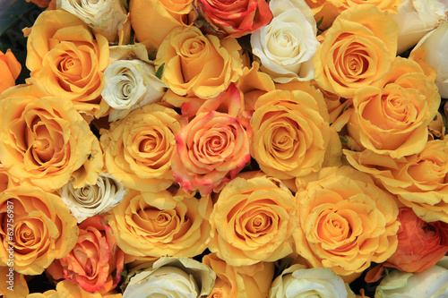 yellow and white rose wedding arrangement