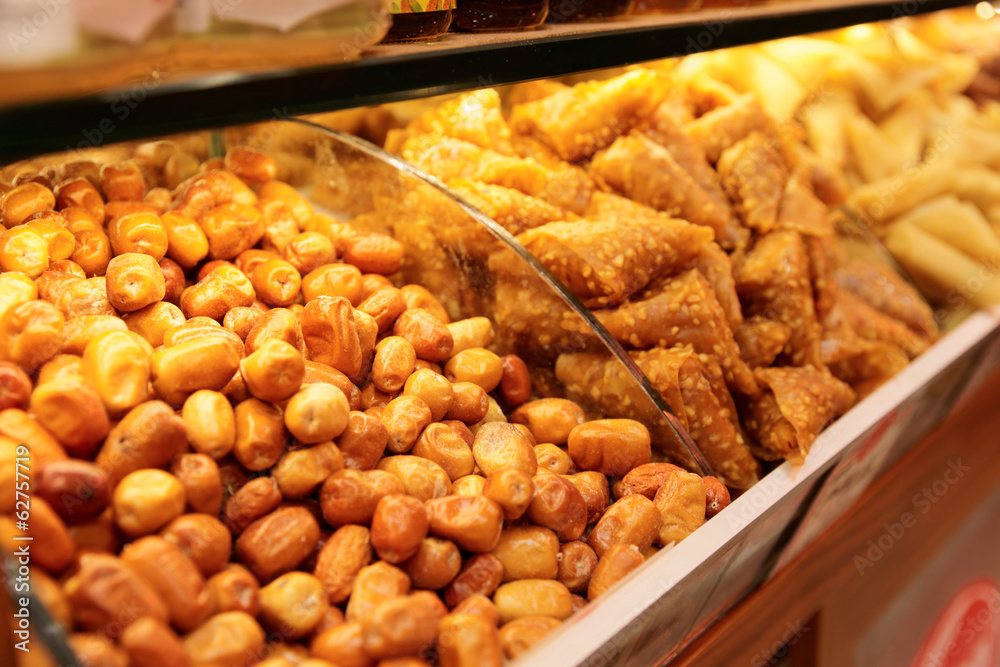 Nuts and baklava on market shelf Nuts and baklava on market shelf