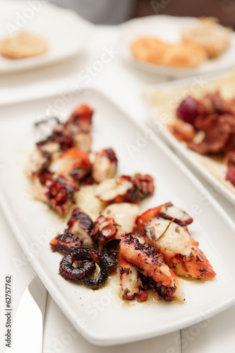 Grilled octopus on plate