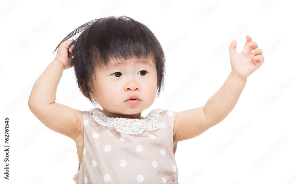 Asia baby girl hands up and touch her head Asia baby girl hands up and touch her head