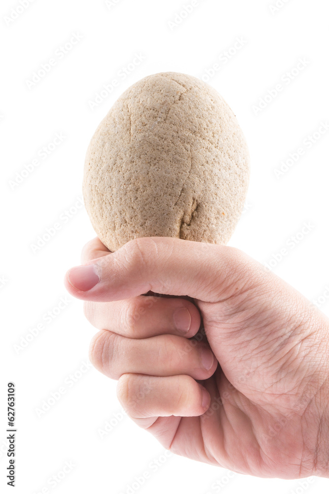 isolated of the hand is holding to stone in spa on white backgro isolated of the hand is holding to stone in spa on white backgro