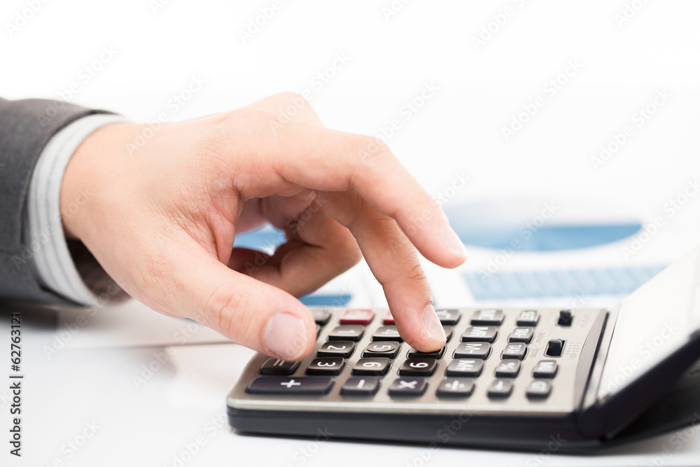 Businessman's hand showing financial report Businessman's hand showing financial report
