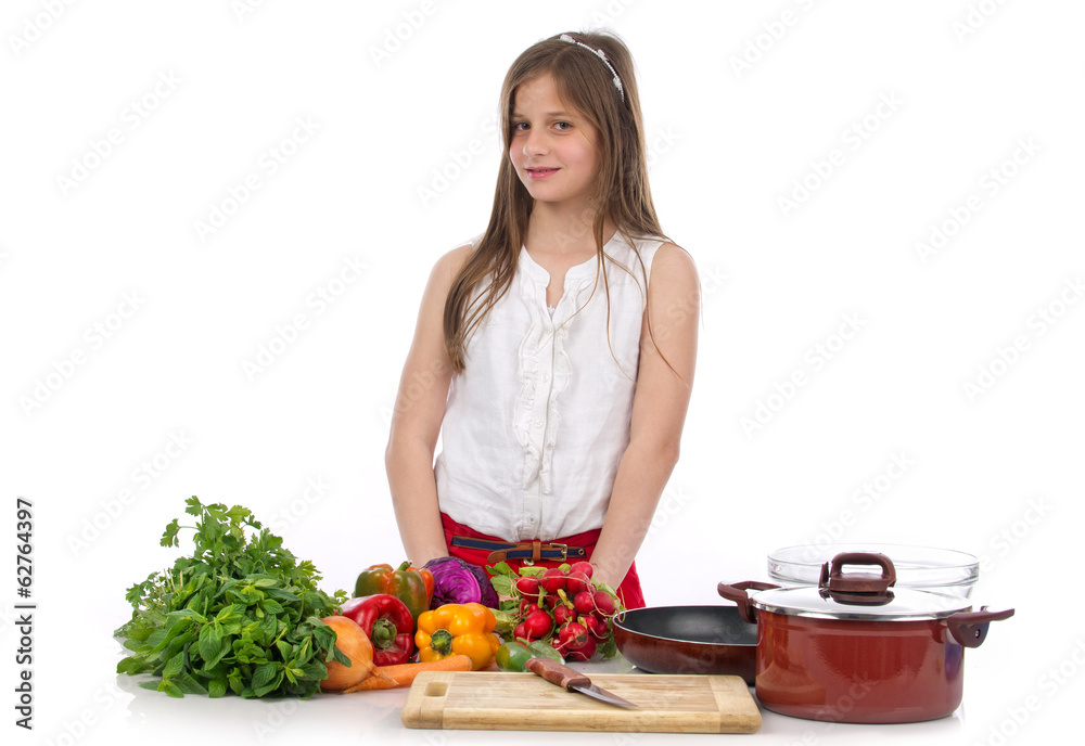 A young teenage girl preparing food isolated on white..
