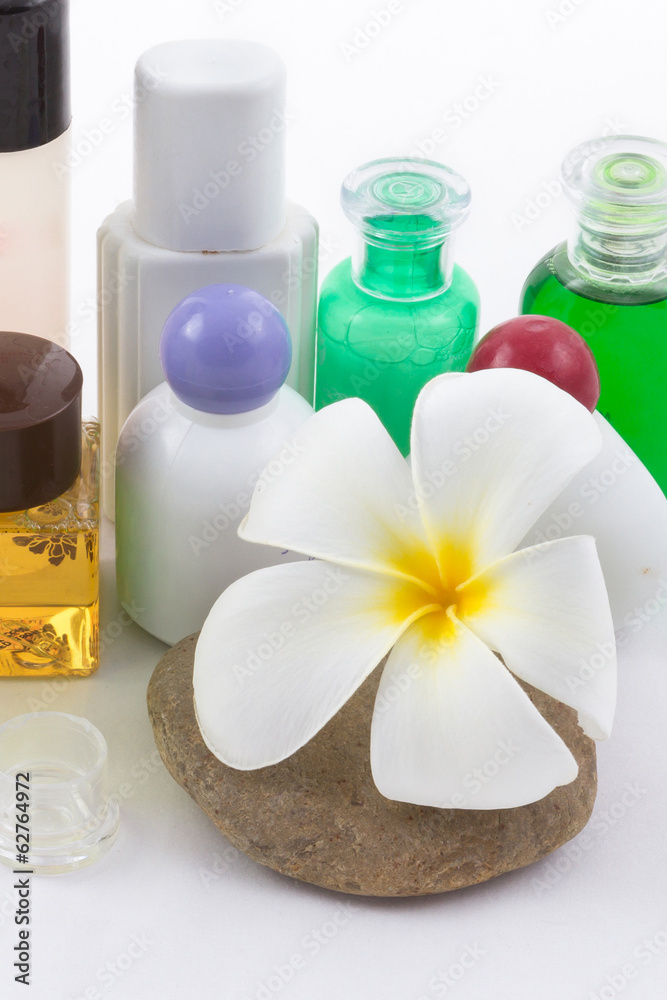 isolated of the foot with frangipani flower in spa on white back isolated of the foot with frangipani flower in spa on white back