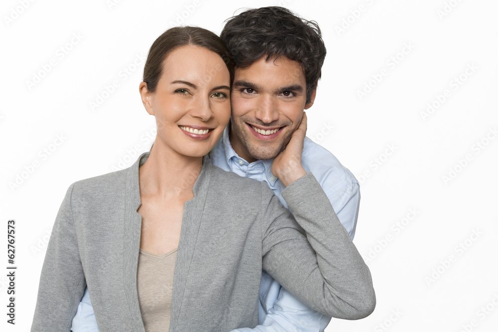 Happy  young lover couple standing on white background, isolated