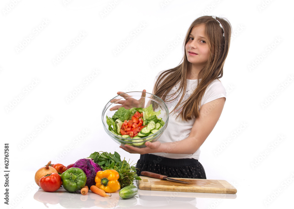 A young teenage girl holding a bowl of salad isolated on white.. A young teenage girl holding a bowl of salad isolated on white..