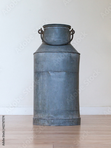 Old metal milk can photo