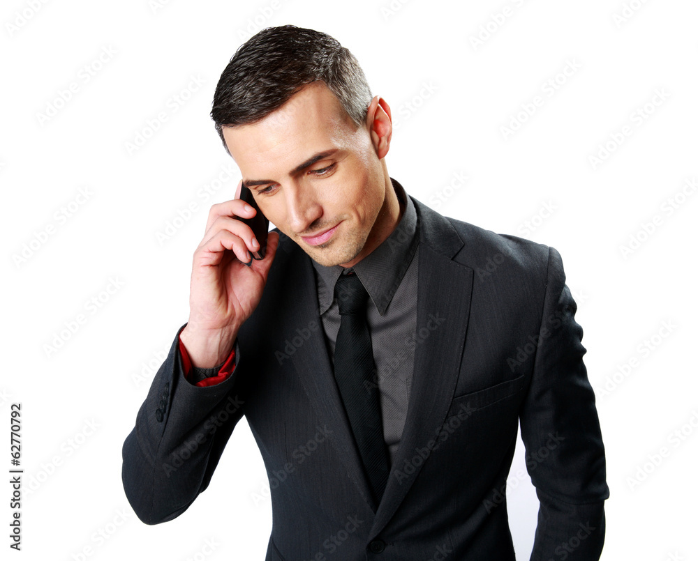 Portrait of a businessman speaking on cell phone Portrait of a businessman speaking on cell phone