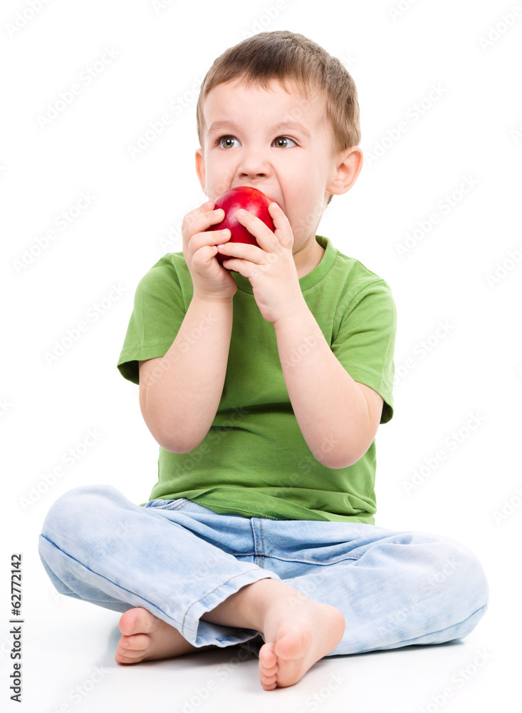 Portrait of a cute little boy with red apple Portrait of a cute little boy with red apple