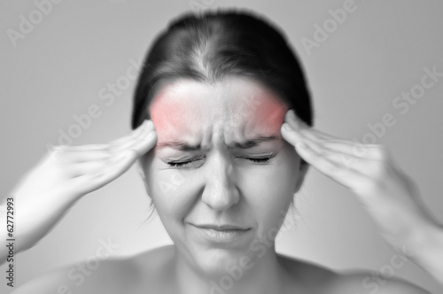 Young woman having migraine