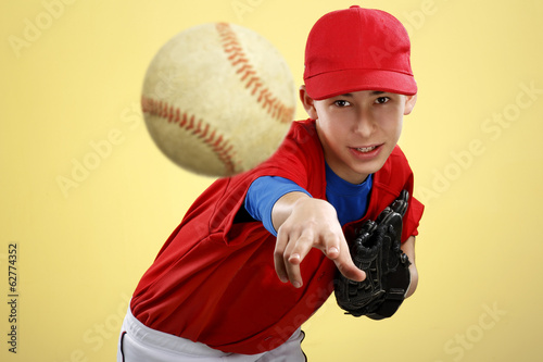 portrait of a beautiful teen baseball player in red and white un