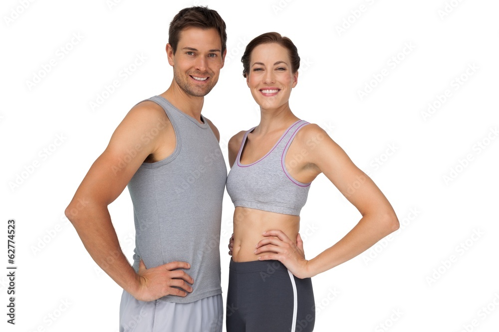 Portrait of a happy fit couple with hands on hips Portrait of a happy fit couple with hands on hips
