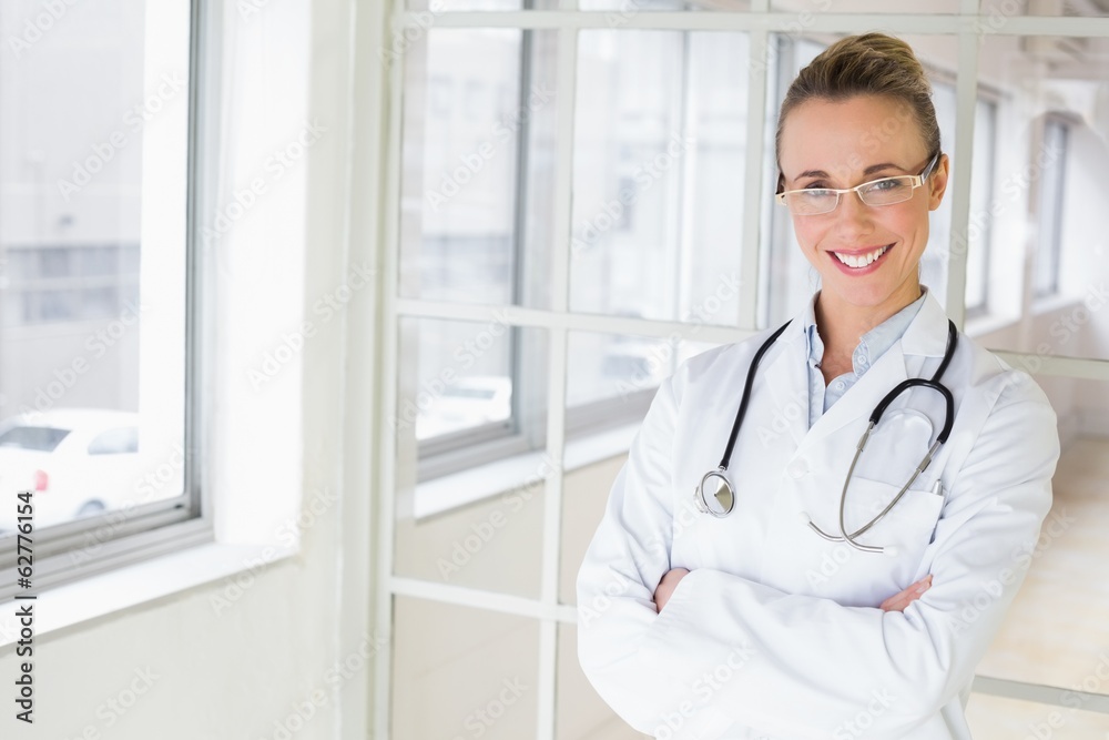 Beautiful female doctor with arms crossed in hospital Beautiful female doctor with arms crossed in hospital