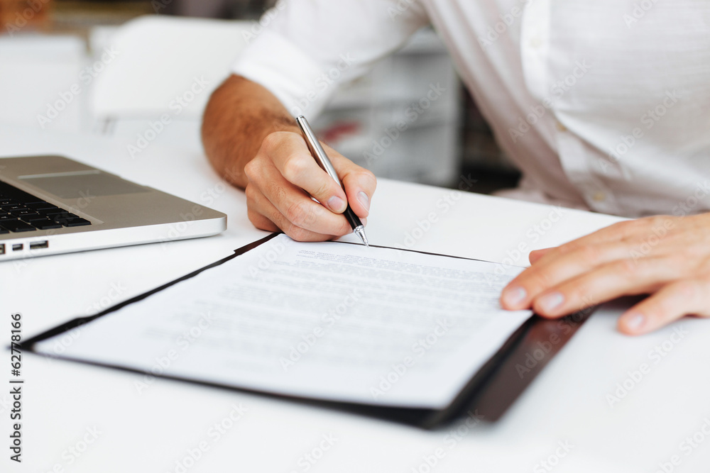 Close up of entrepreneur signing contract