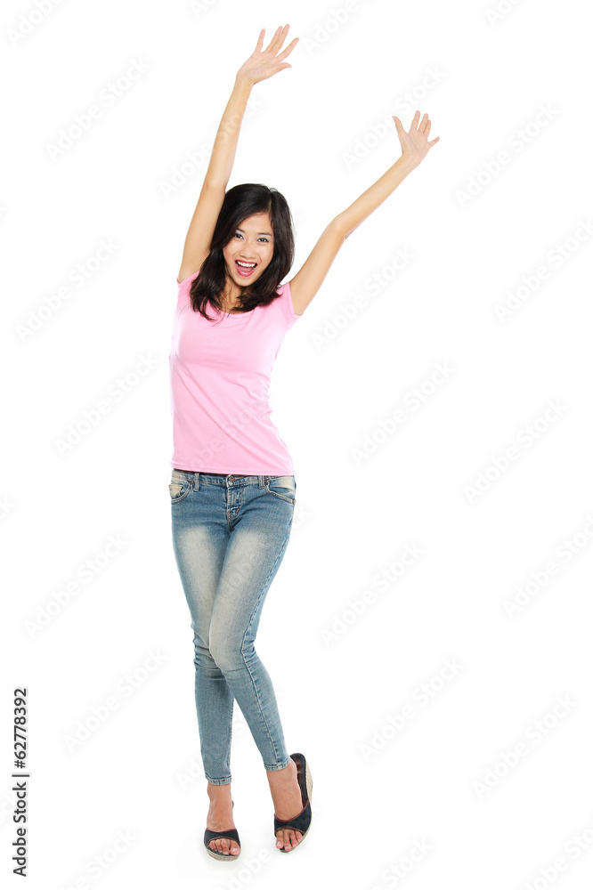 Attractive young happy woman raised her arm