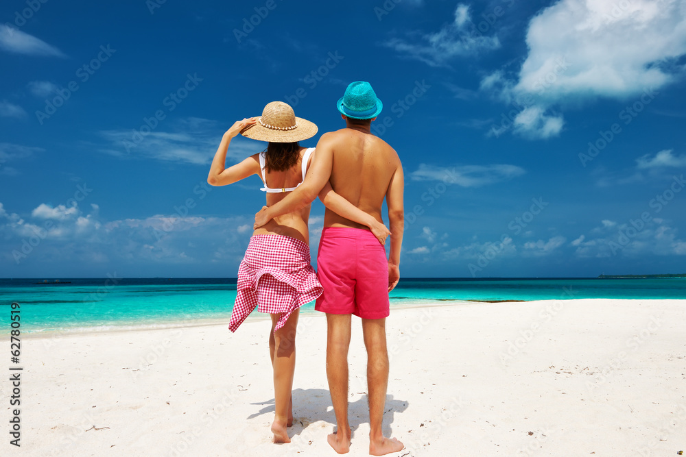 Couple in blue on a beach at Maldives