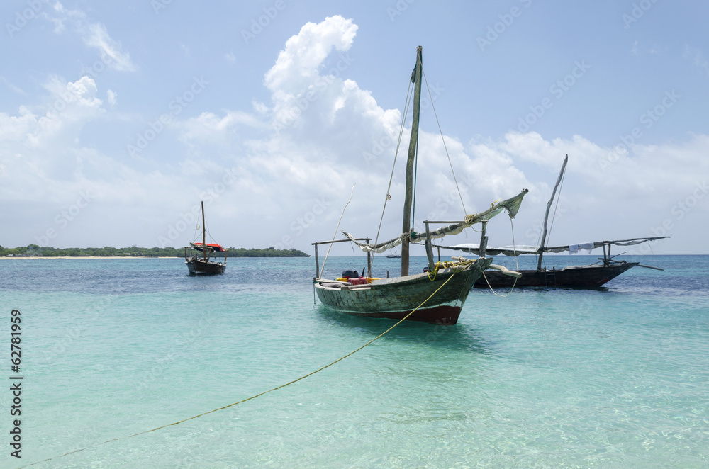 Wooden boat on turquoise water in Zanzibar, Tanzania, Africa