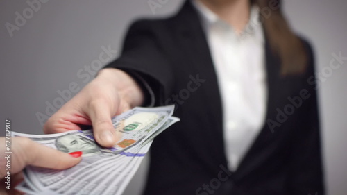 businesswoman giving money away