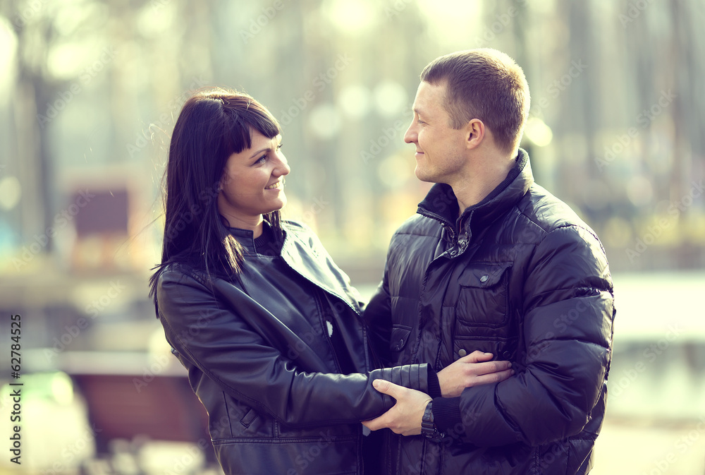 pair of lovers in the park for a walk pair of lovers in the park for a walk